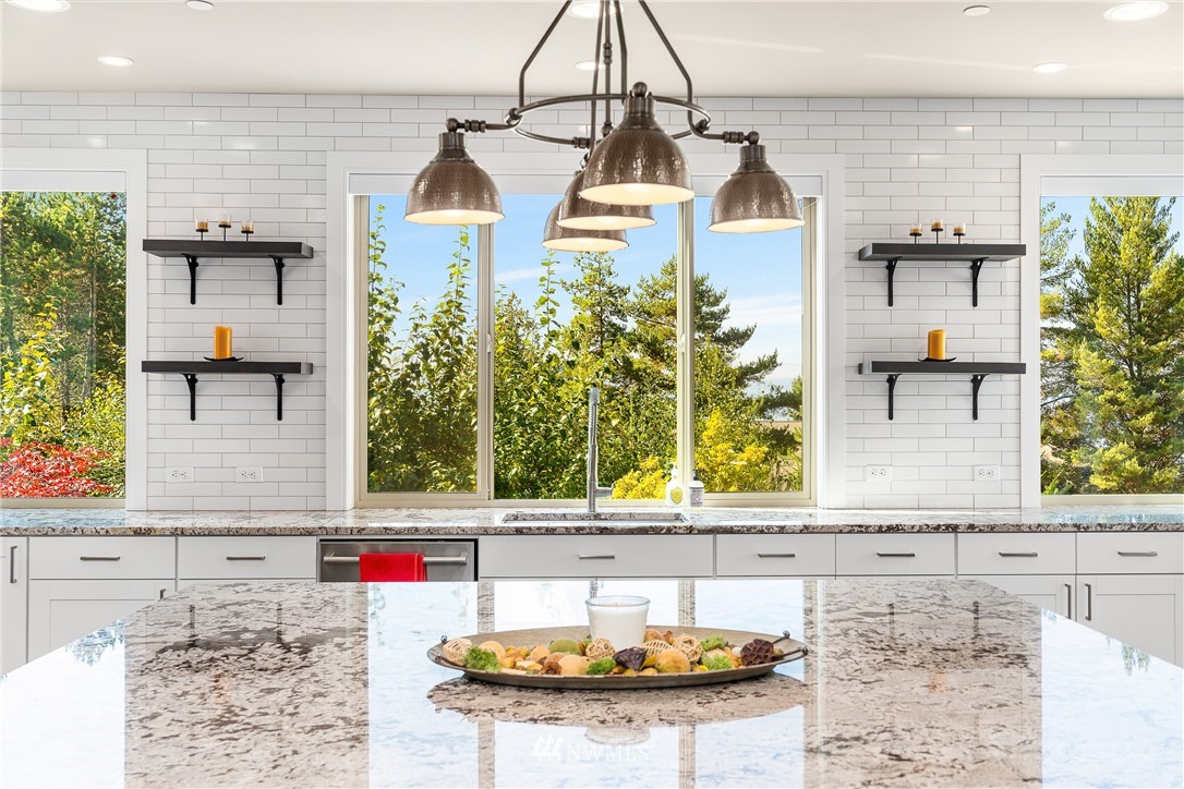 10406 Northeast 52nd Street Kirkland, WA 98033 - Photo 10 of 36 a bathroom with a granite countertop sink and a mirror