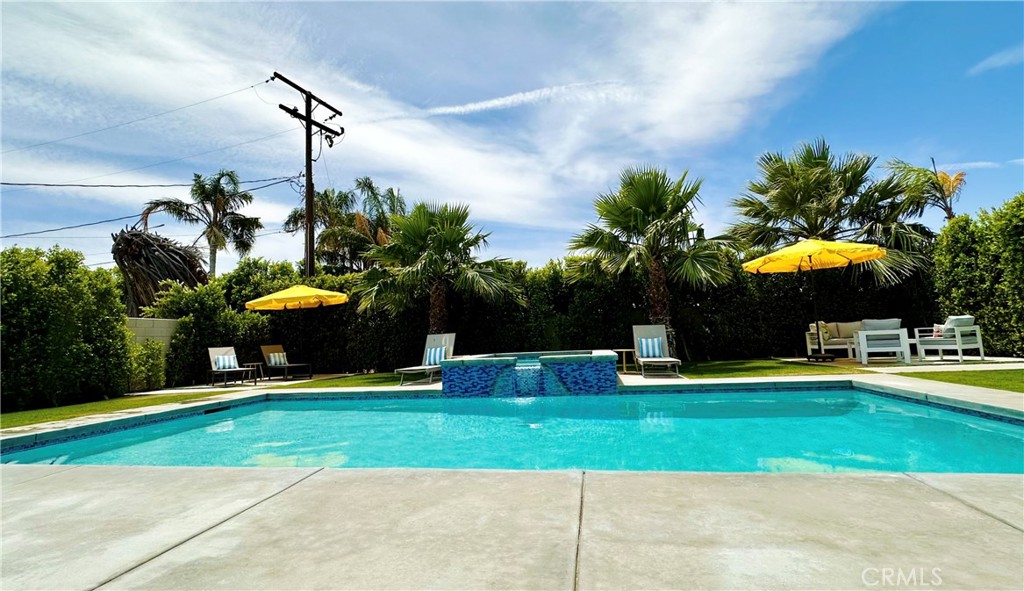 68315 Modalo Road Cathedral City, CA 92234 - Photo 13 of 18 a view of a house with a swimming pool