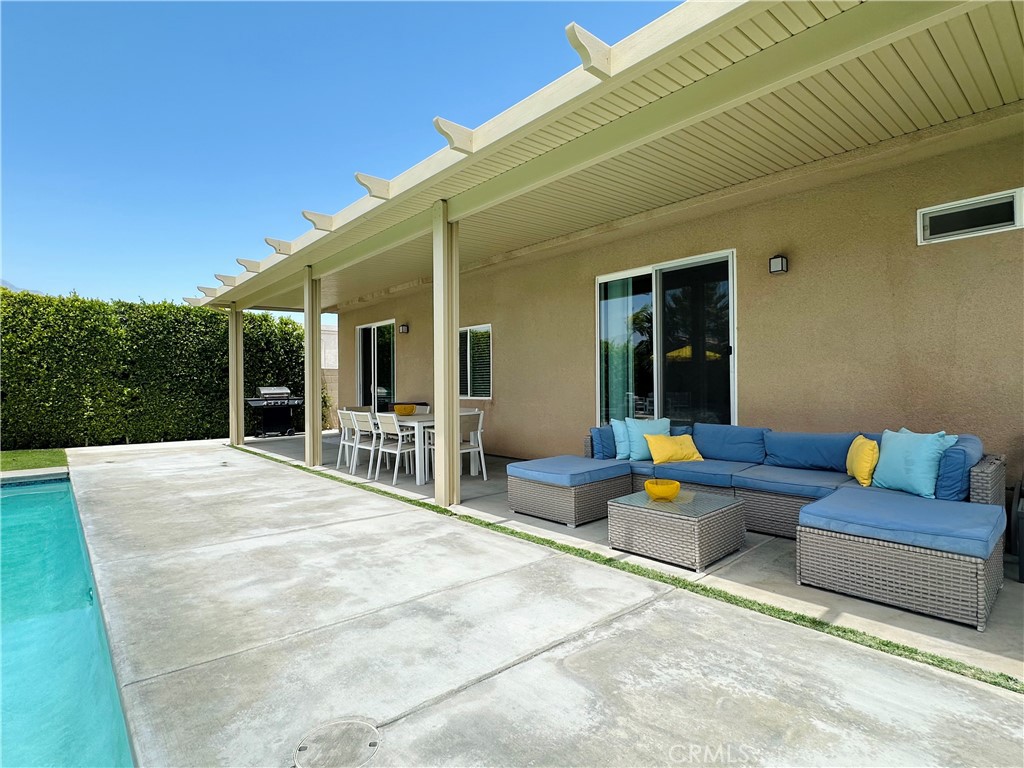 68315 Modalo Road Cathedral City, CA 92234 - Photo 17 of 18 a outdoor space with patio furniture and a potted plant