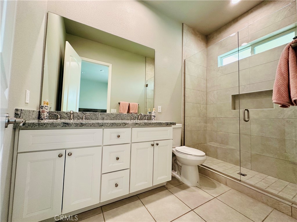 68315 Modalo Road Cathedral City, CA 92234 - Photo 9 of 18 a bathroom with a toilet sink and a mirror