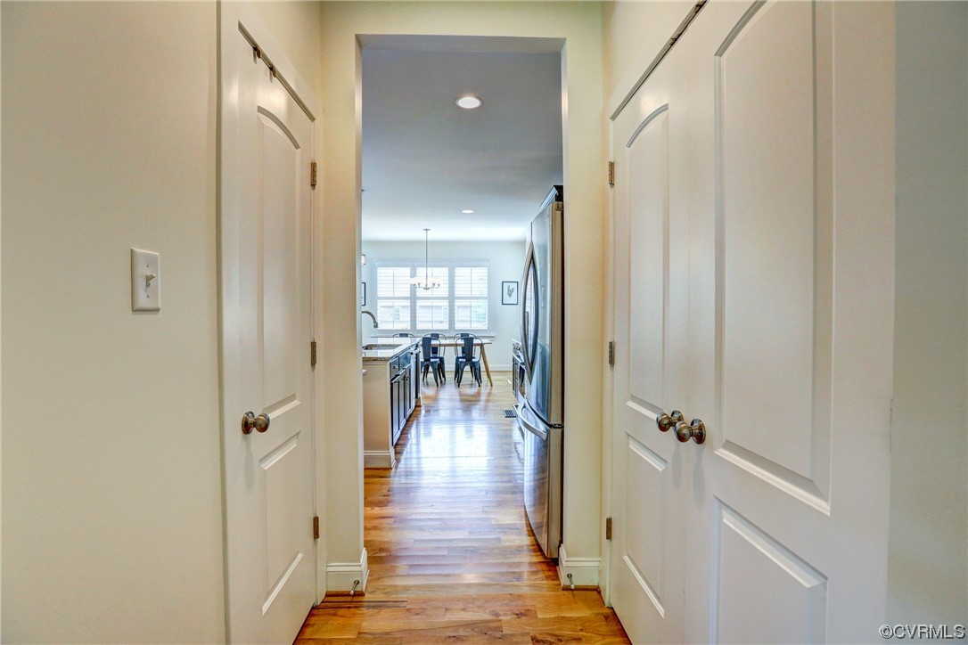 2007 Colwyn Bay Drive Midlothian, VA 23112 - Photo 14 of 49 a view of a hallway with wooden floor and a living room