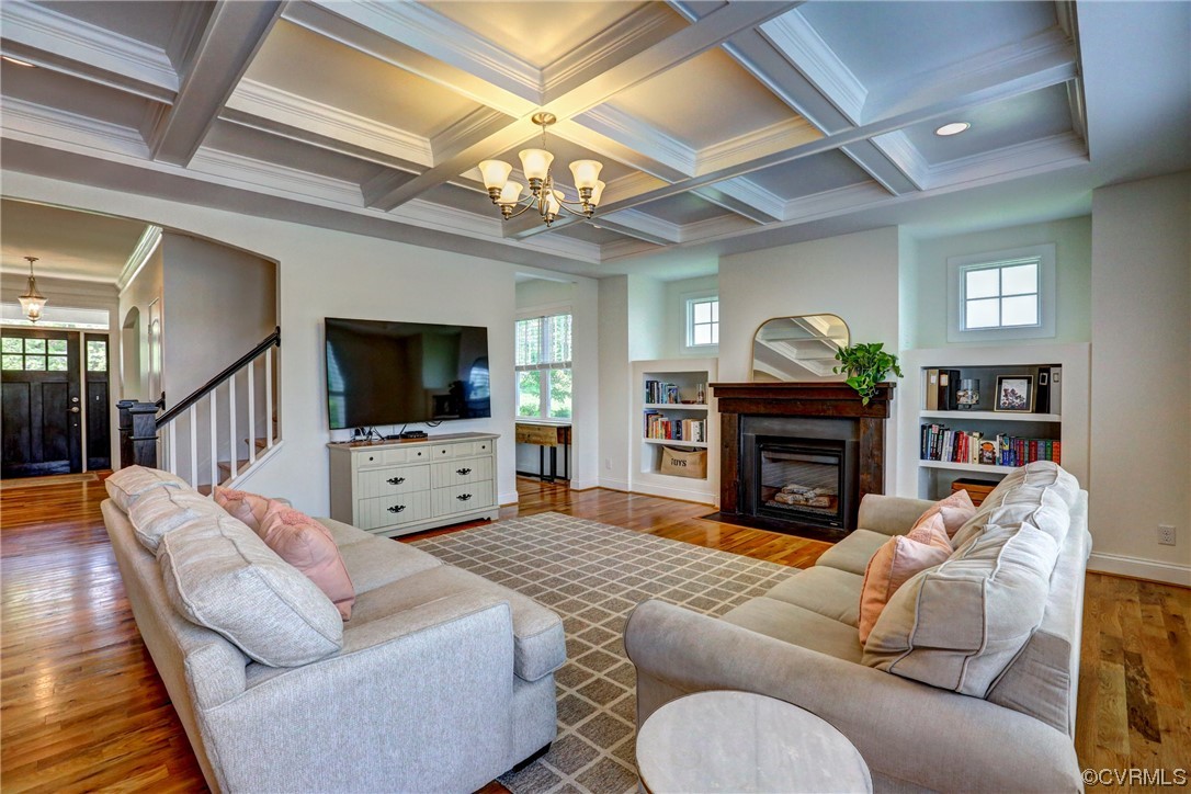 2007 Colwyn Bay Drive Midlothian, VA 23112 - Photo 20 of 49 a living room with furniture a flat screen tv and a chandelier