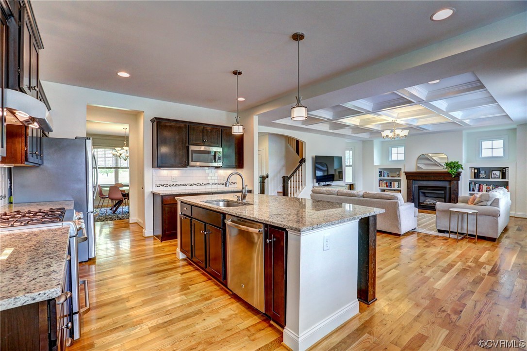 2007 Colwyn Bay Drive Midlothian, VA 23112 - Photo 23 of 49 a large kitchen with stainless steel appliances kitchen island granite countertop a large kitchen island and a couch