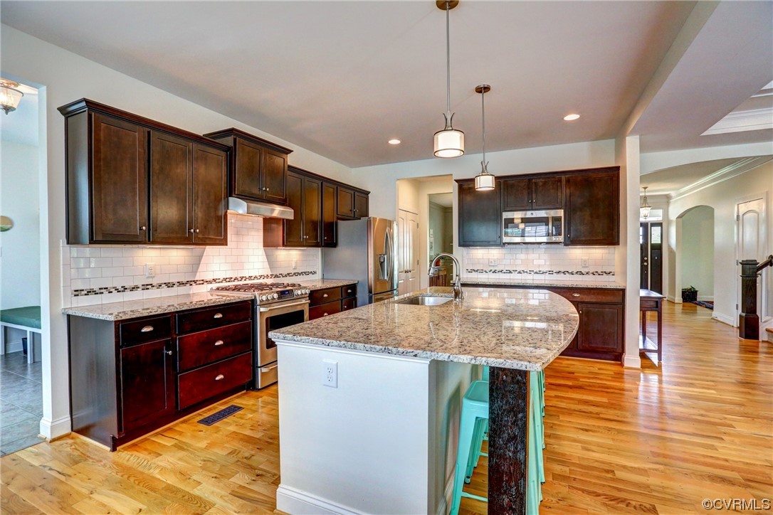 2007 Colwyn Bay Drive Midlothian, VA 23112 - Photo 25 of 49 a kitchen with kitchen island granite countertop wooden cabinets and a sink