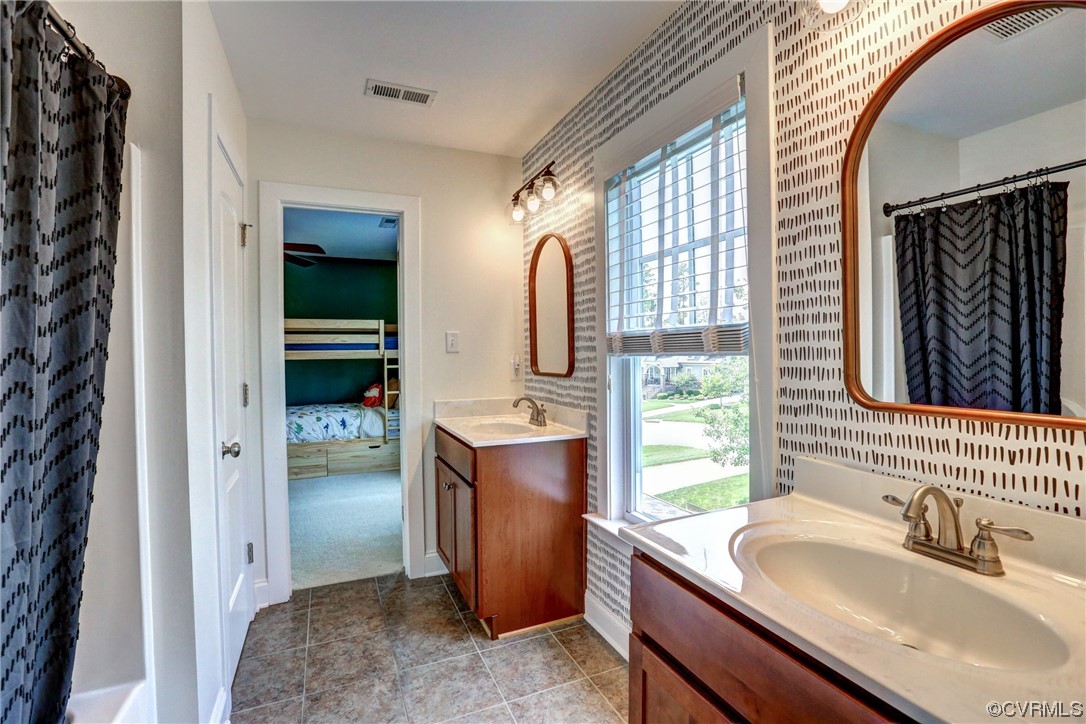 2007 Colwyn Bay Drive Midlothian, VA 23112 - Photo 35 of 49 a bathroom with a sink a mirror and shower
