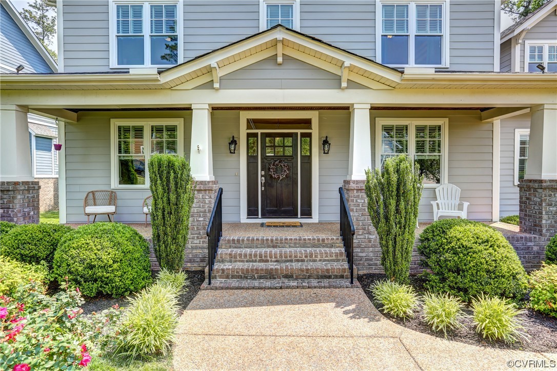 2007 Colwyn Bay Drive Midlothian, VA 23112 - Photo 4 of 49 a front view of a house with a porch