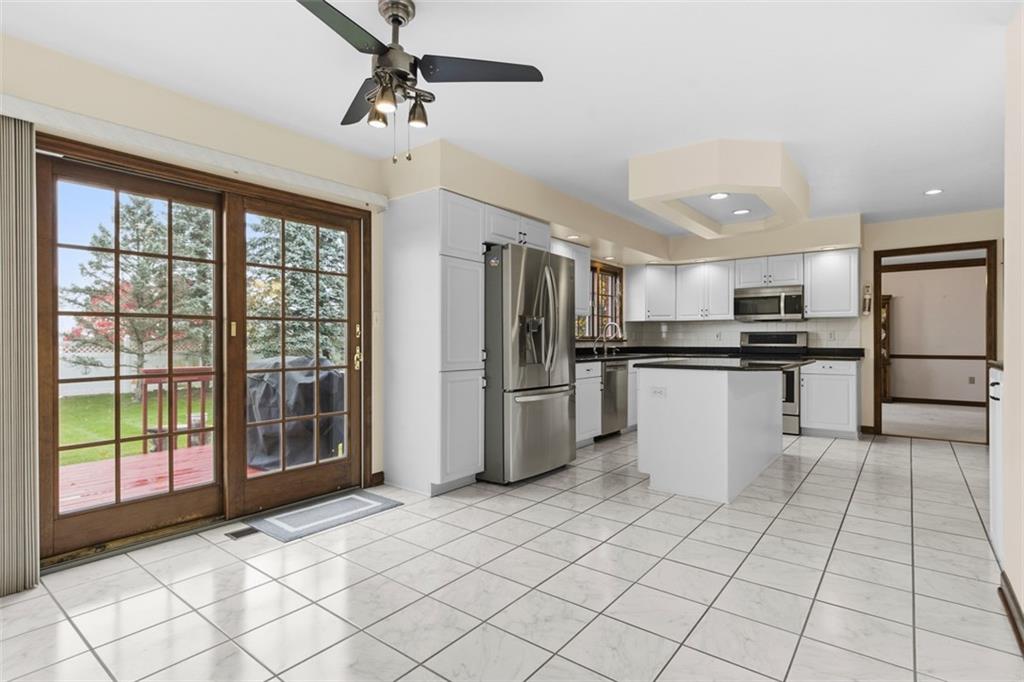 370 Cobblestone Circle McKees Rocks, PA 15136 - Photo 15 of 50 a kitchen with stainless steel appliances a refrigerator sink and cabinets
