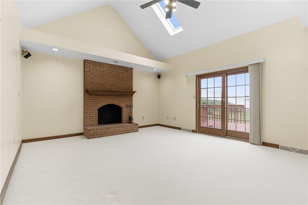 370 Cobblestone Circle McKees Rocks, PA 15136 - Photo 17 of 50 an empty room with fireplace and windows
