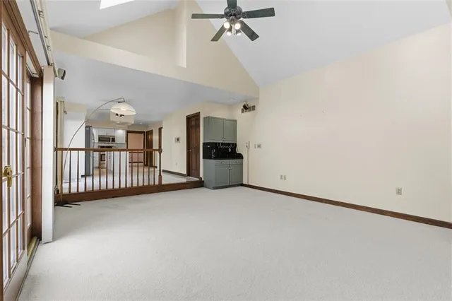 en view interior of a house with wooden floor and windows