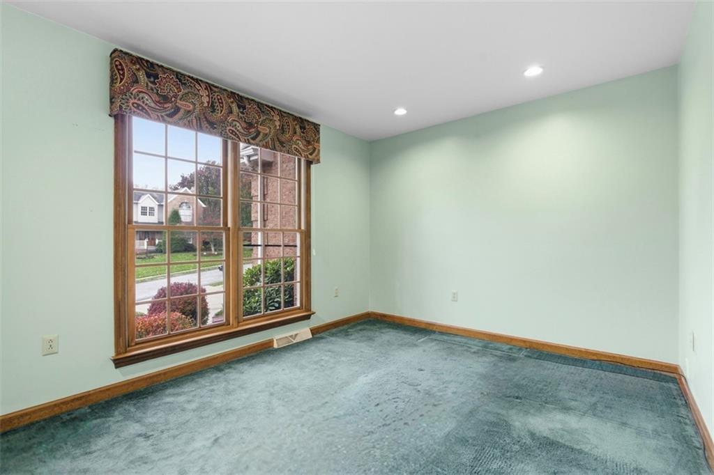 370 Cobblestone Circle McKees Rocks, PA 15136 - Photo 20 of 50 a view of an empty room with wooden floor and a window
