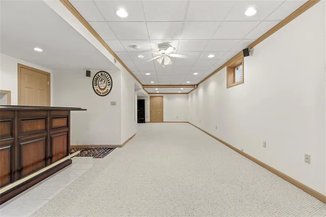 a view of a hallway with a large tree