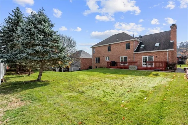 a house view with a sitting space and garden