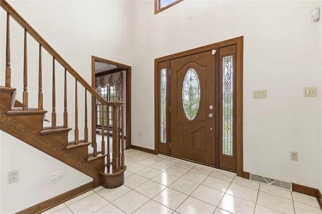 a view of an entryway with wooden floor