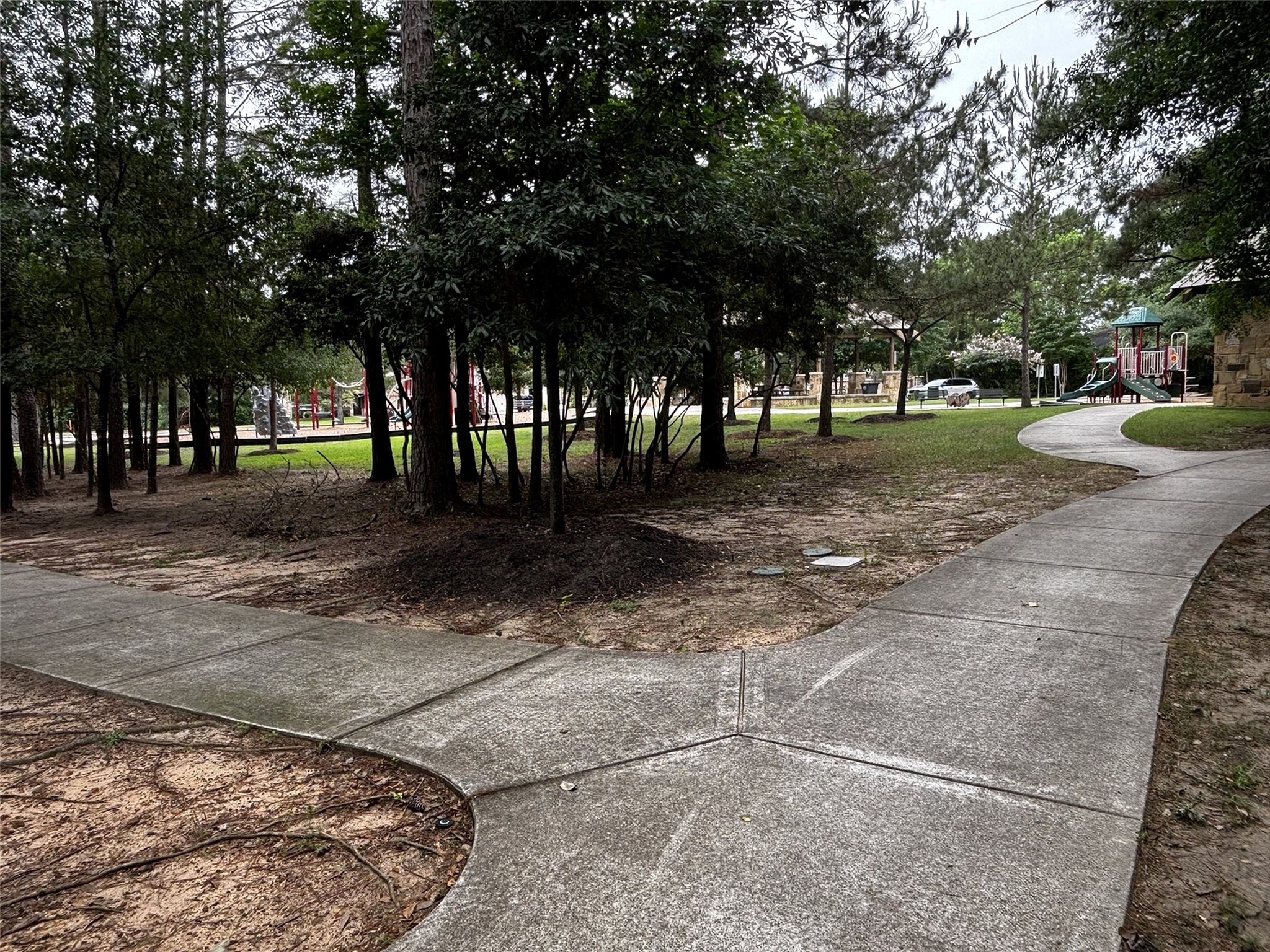 7562 Fettle Lane Conroe, TX 77304 - Photo 30 of 30 Community walking trails lead to nearby playgrounds, picnic areas, and shaded green space, offering a peaceful setting for outdoor enjoyment.