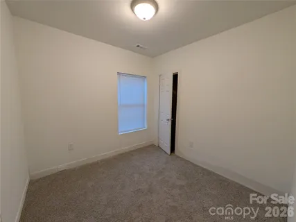 an empty room with a hallway
