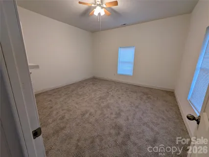 a view of hallway with wooden floor