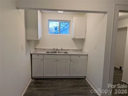 a view of cabinets with wooden floor