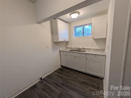 a kitchen with a sink and cabinets