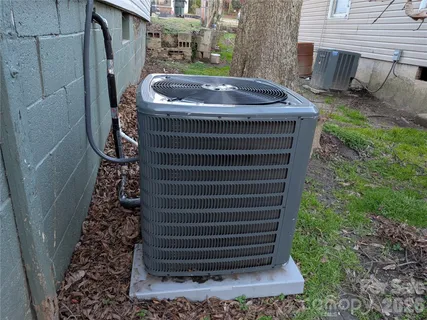 a view of a small house and a yard