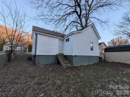 a view of backyard with green space