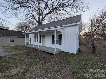 a house with trees in front of it