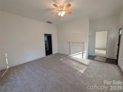 an empty room with a bathroom