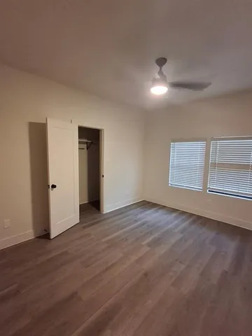 a bathroom with a double vanity sink toilet and a mirror