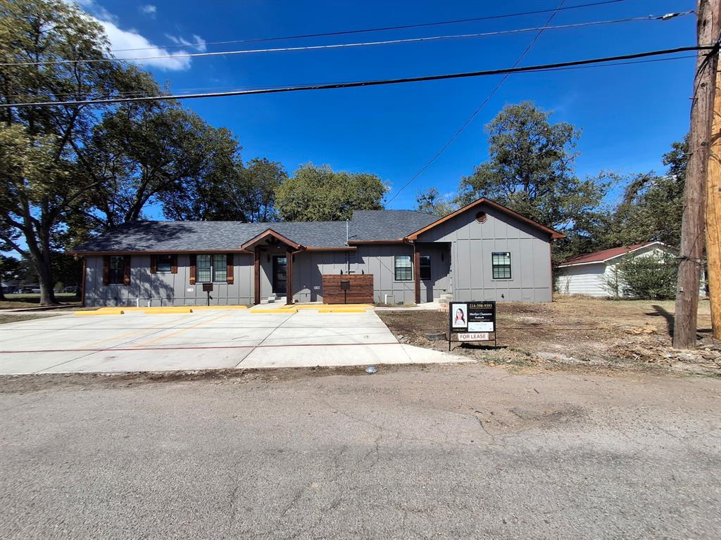902 Chestnut Street Commerce, TX 75428 - Photo 2 of 18 a view of house with outdoor space and sitting area