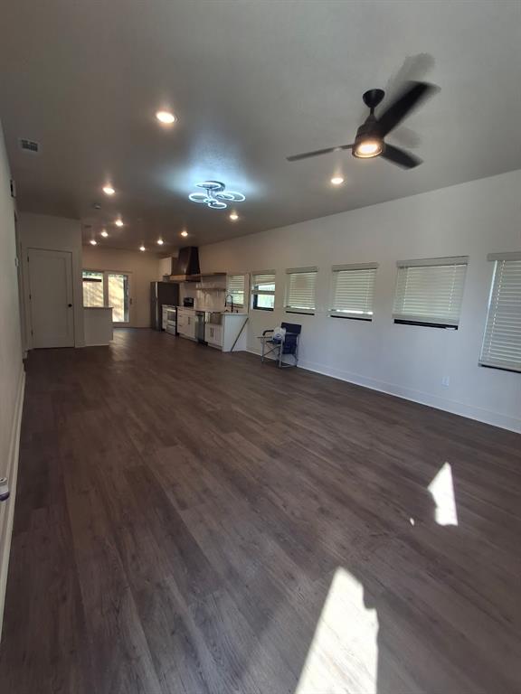 902 Chestnut Street Commerce, TX 75428 - Photo 6 of 18 a view of a room with lots of wooden furniture