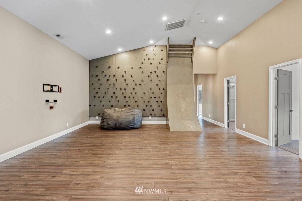 195 Puma Road Longview, WA 98632 - Photo 13 of 39 a view of an empty room with wooden floor and windows