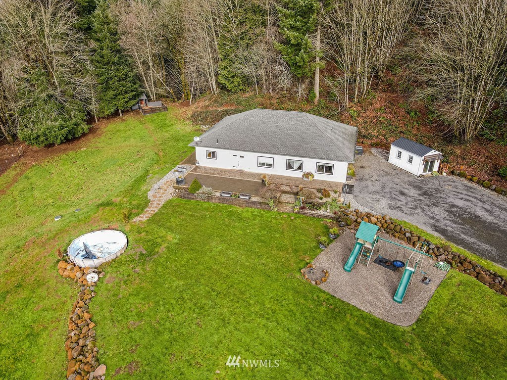 195 Puma Road Longview, WA 98632 - Photo 2 of 39 an aerial view of a house with garden space and street view