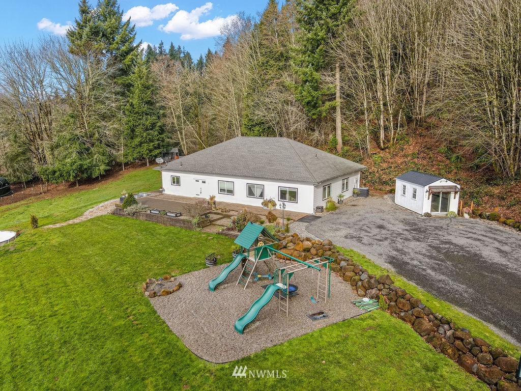 195 Puma Road Longview, WA 98632 - Photo 39 of 39 an aerial view of a house with garden space and trees