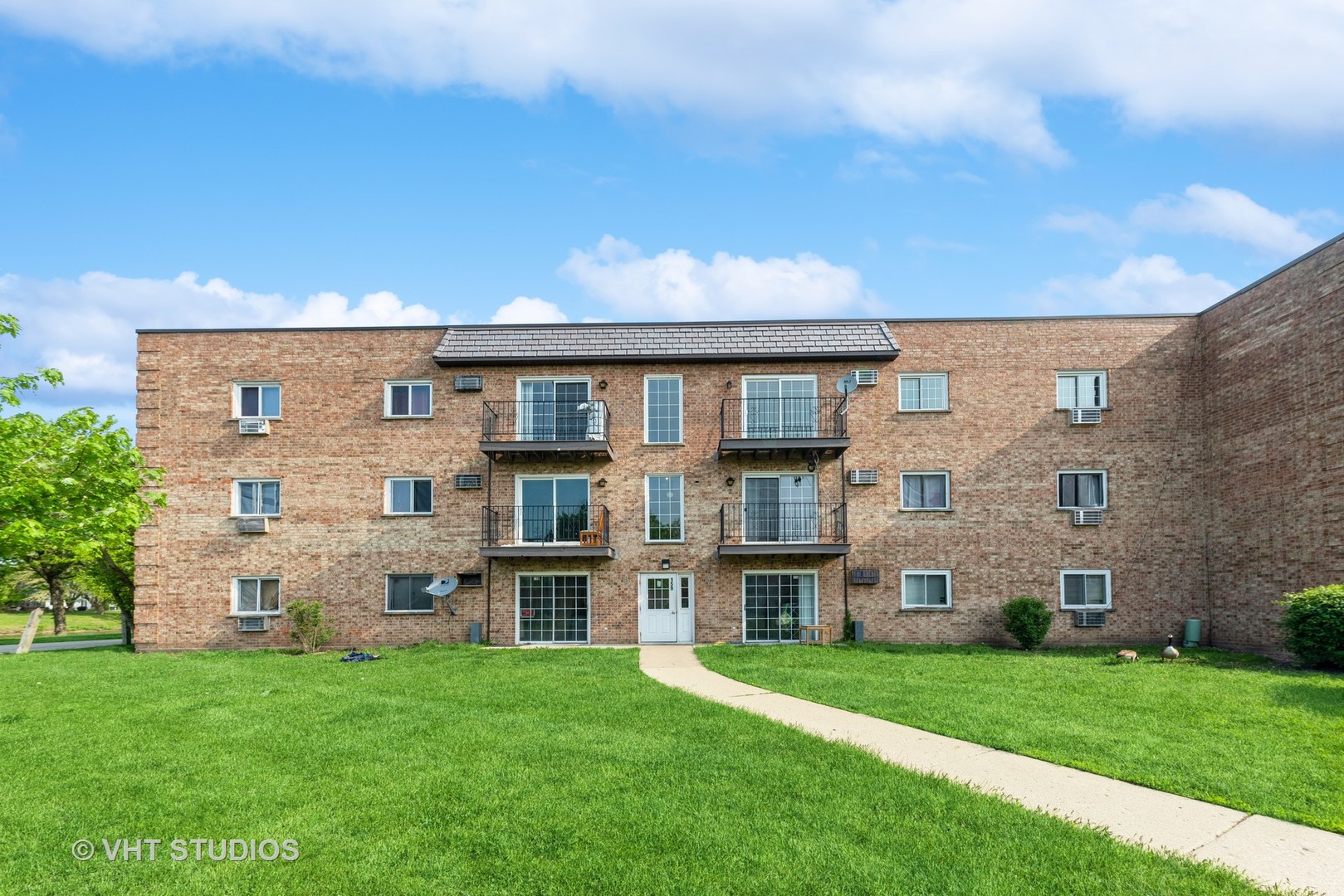159 West Elk Trail, Unit 356 Carol Stream, IL 60188 - Photo 1 of 21 front view of a house with a yard