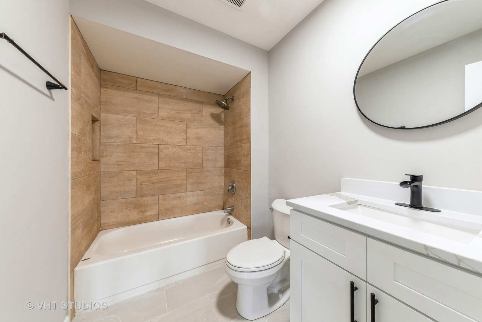 159 West Elk Trail, Unit 356 Carol Stream, IL 60188 - Photo 12 of 21 a bathroom with a sink a toilet and a mirror