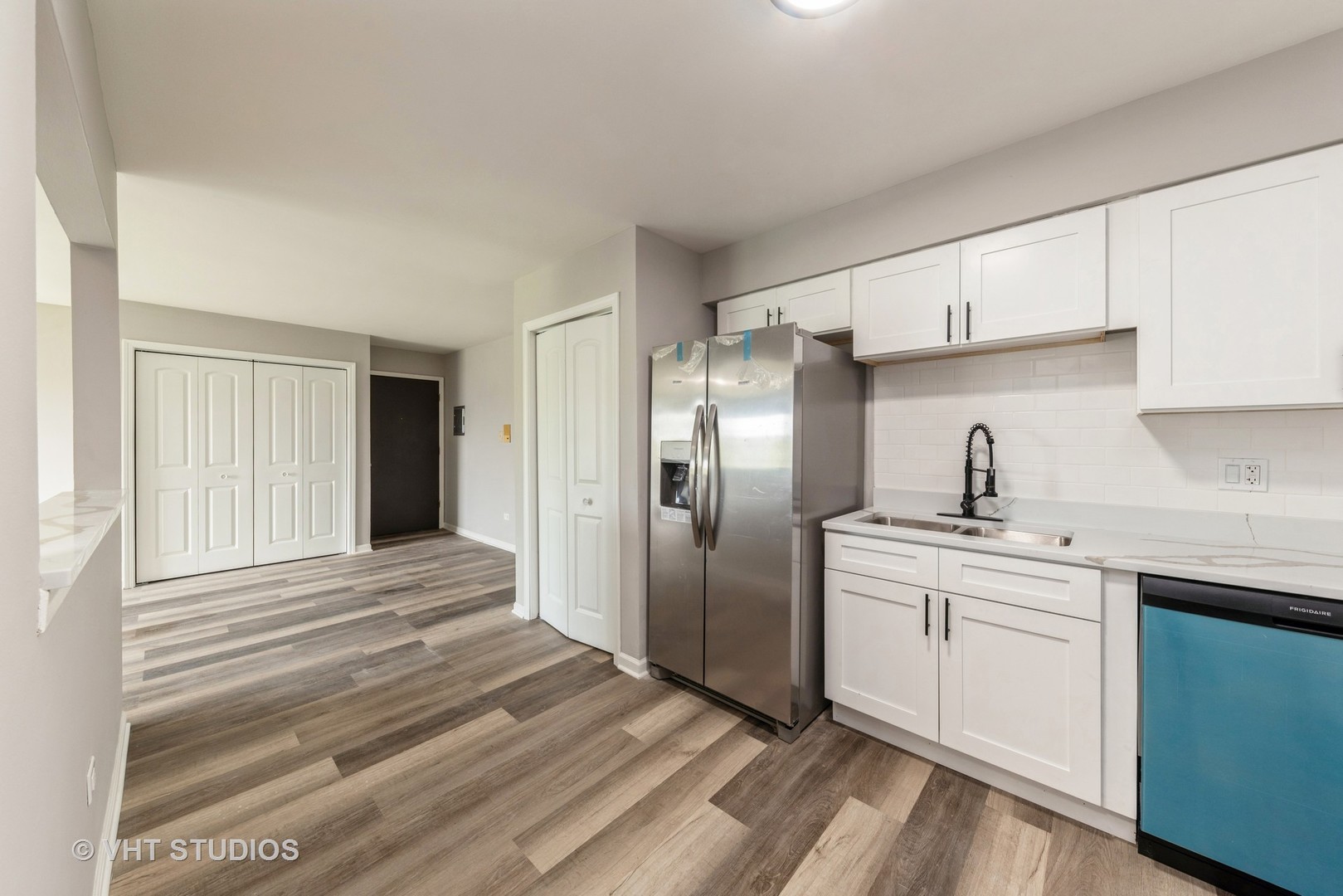 159 West Elk Trail, Unit 356 Carol Stream, IL 60188 - Photo 6 of 21 a kitchen with stainless steel appliances granite countertop a refrigerator sink and cabinets