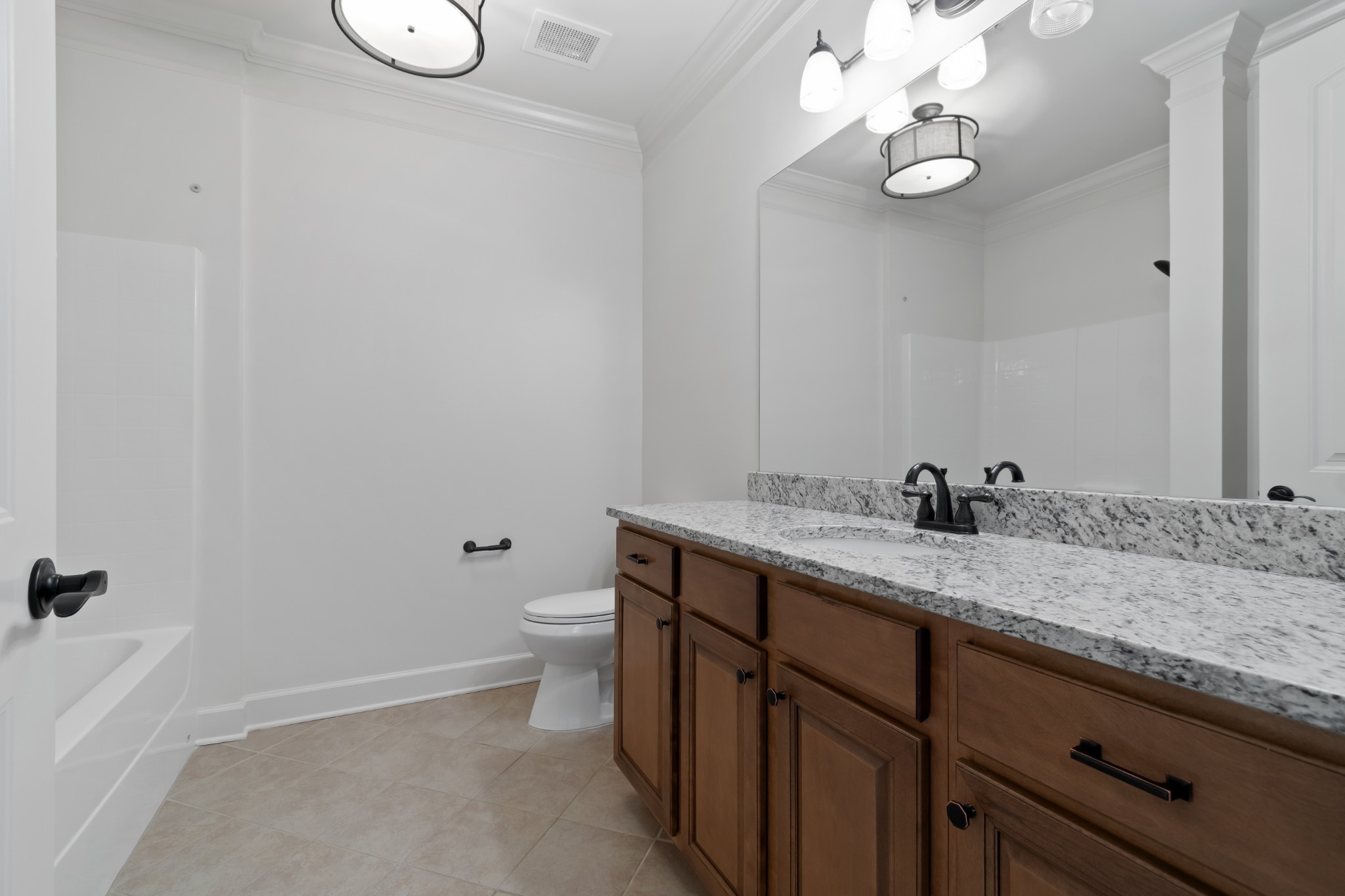 106 Front Street, Unit 23 Franklin, TN 37064 - Photo 13 of 39 a bathroom with a granite countertop sink mirror and toilet