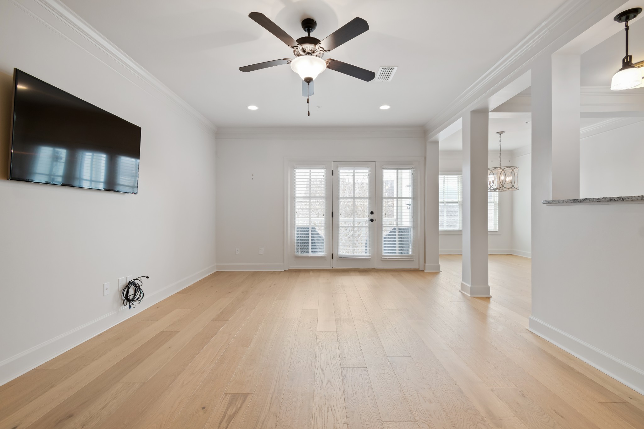 106 Front Street, Unit 23 Franklin, TN 37064 - Photo 22 of 39 a view of an empty room with a window and a kitchen