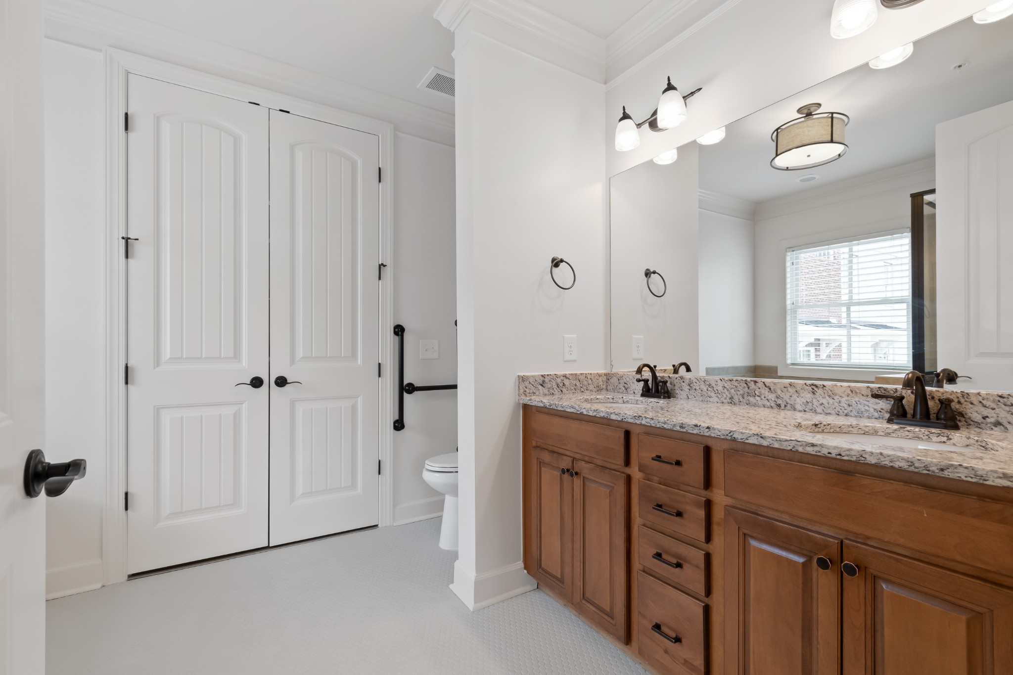 106 Front Street, Unit 23 Franklin, TN 37064 - Photo 31 of 39 a bathroom with a granite countertop sink mirror and a