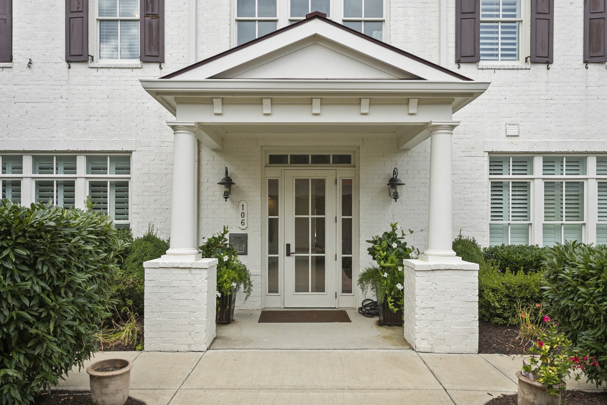 106 Front Street, Unit 23 Franklin, TN 37064 - Photo 6 of 39 a front view of a house with a garden
