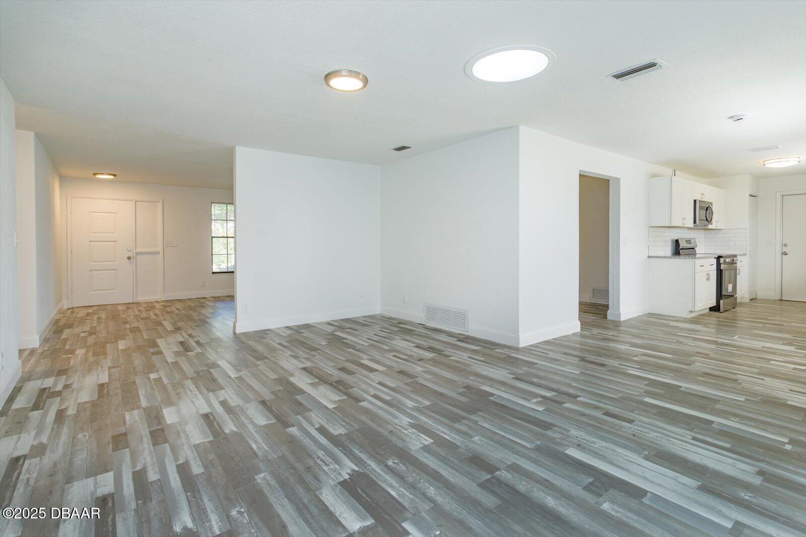 4319 South Peninsula Drive Ponce Inlet, FL 32127 - Photo 13 of 30 a view of empty room with wooden floor
