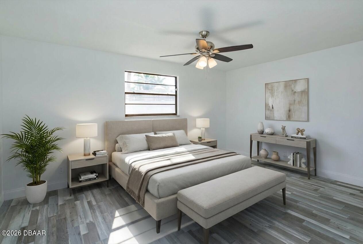 4319 South Peninsula Drive Ponce Inlet, FL 32127 - Photo 5 of 30 a bedroom with a bed and wooden floor