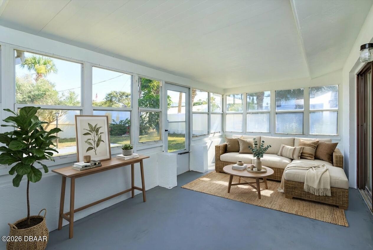 4319 South Peninsula Drive Ponce Inlet, FL 32127 - Photo 6 of 30 a living room with furniture and a potted plant