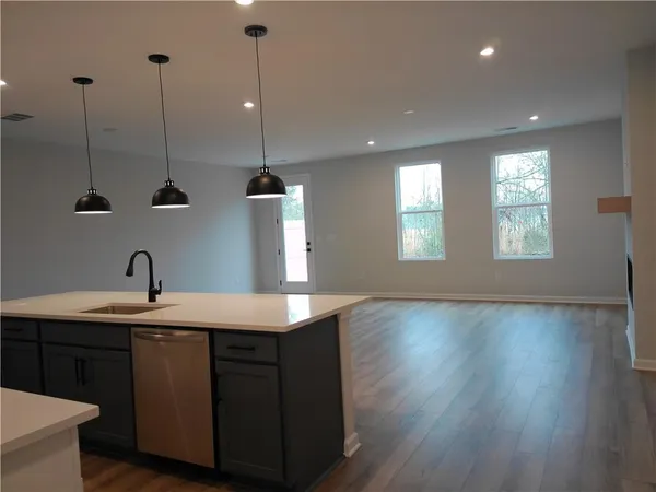 a kitchen with sink and window