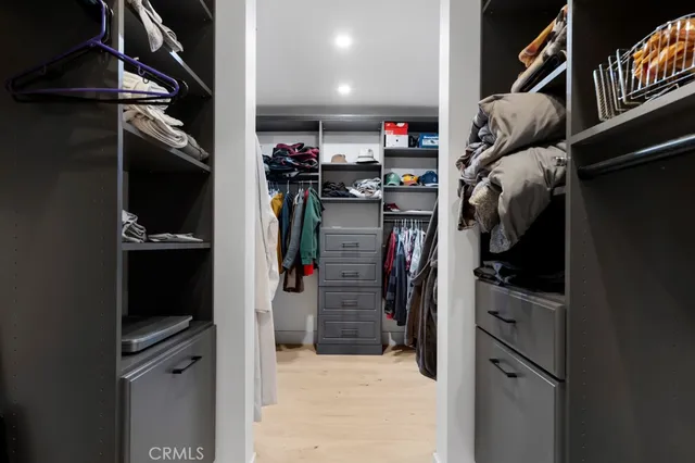 a kitchen with stainless steel appliances a refrigerator a stove a sink and a refrigerator