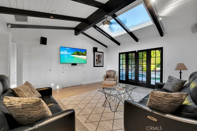 an aerial view of a house with a yard and garden