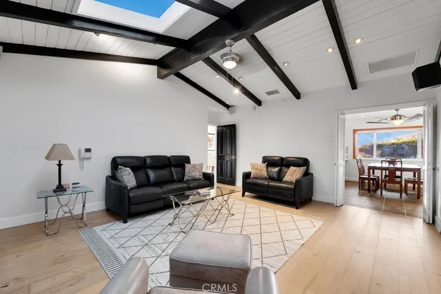 a dining room with furniture a livingroom and chandelier
