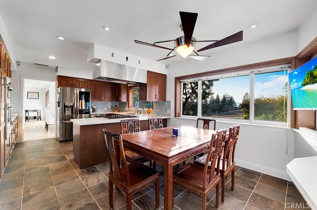 a view of a wooden bench sitting in the grass