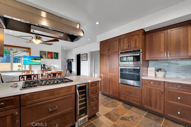 a view of a house with backyard sitting area and garden
