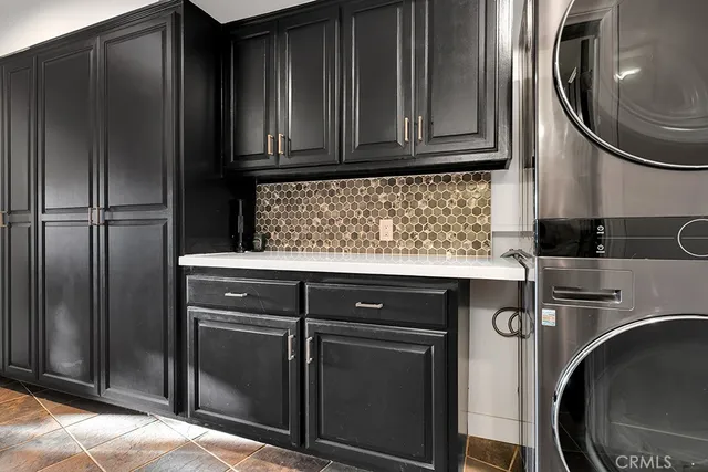 a view of a house with pool patio and swimming pool