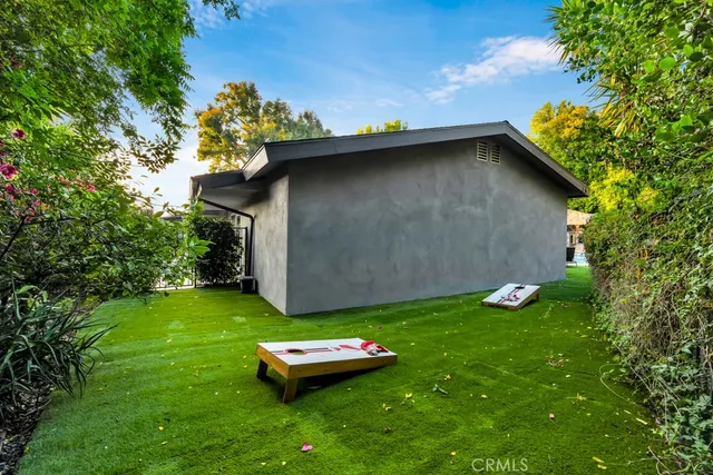 a view of a chair and tables in the balcony